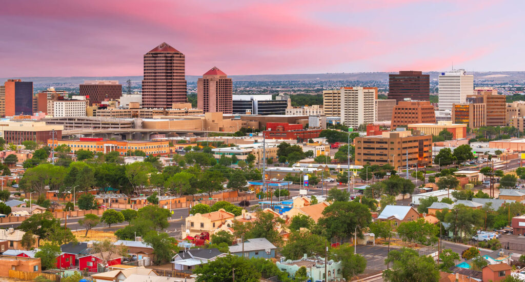 A view of the city from above at sunset.