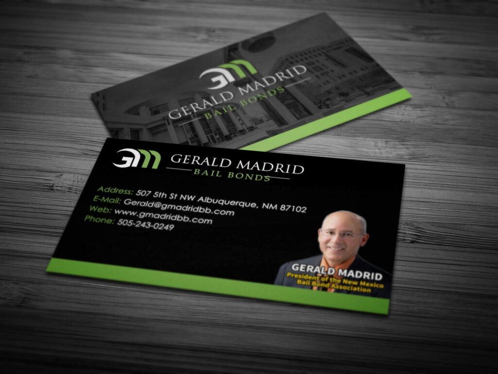 A business card with an image of a building and the name of gerald madrid.