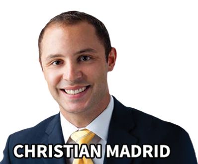 A man in suit and tie with name of christian madrid